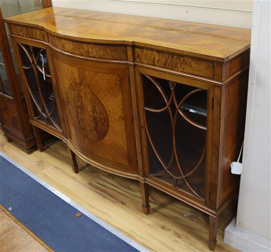 An Edwardian satinwood bow-fronted low bookcase W.153cm